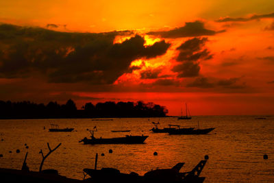 Scenic view of sea against orange sky