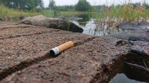 Close-up of cigarette on water