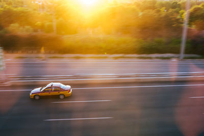 Tilt shift image of car on street