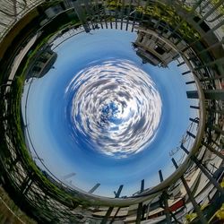 Digital composite image of building and trees against sky