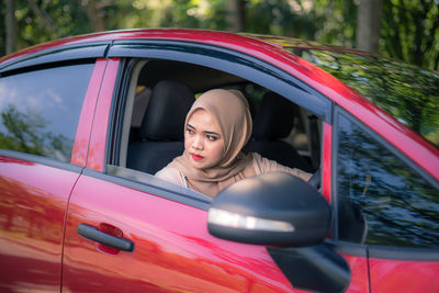 Portrait of woman in car