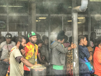 Group of people at market stall