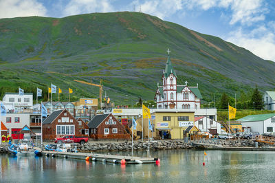 Seafront view at husavik harbor and husavik church