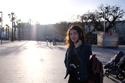 Portrait of woman on street in city