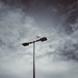 Low angle view of street light against sky