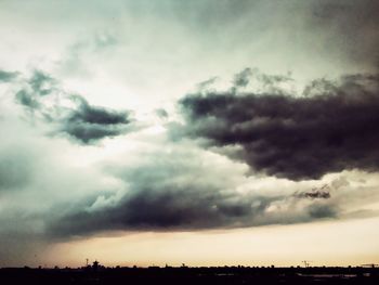 Scenic view of landscape against cloudy sky