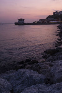 Scenic view of sea against sky at sunset