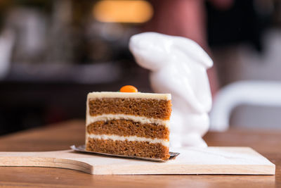 Close-up of cake slice on cutting board