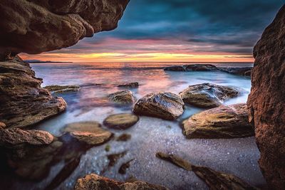 Scenic view of sea against cloudy sky