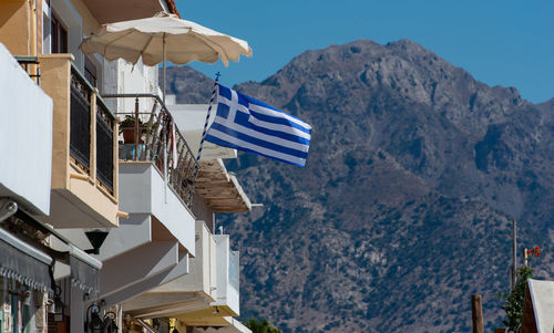 Greece flag on a building in kardamaina kos