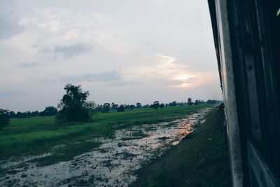 Scenic view of field against sky during sunset