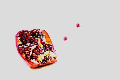 Close-up of fruits against white background