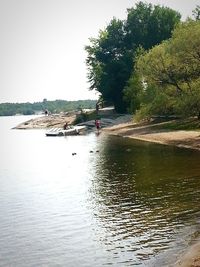 People on boat in river