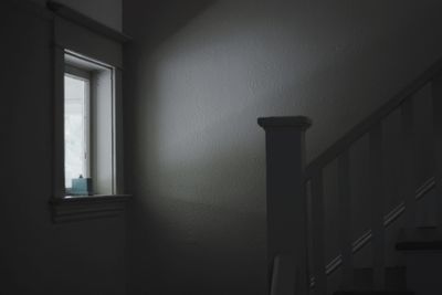 Shadow of railing on wall of building