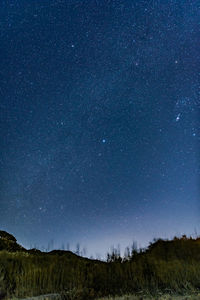 Scenic view of star field against sky at night