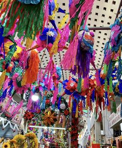 Low angle view of decoration hanging for sale at market stall