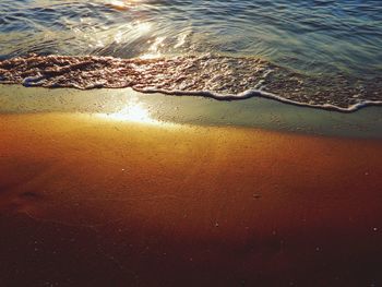 High angle view of sea shore during sunset