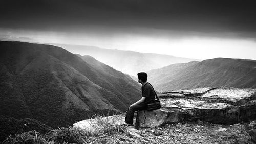 Full length of woman standing on mountain