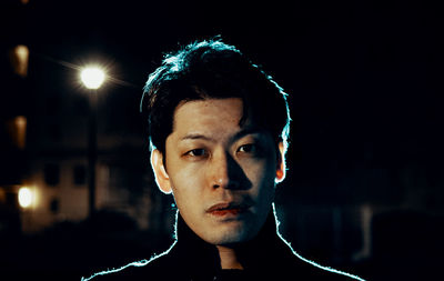 Portrait of young man standing outdoors