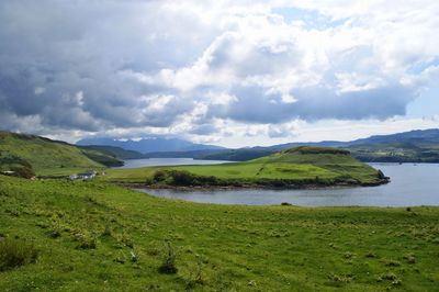 Scenic view of lake against cloudy sky