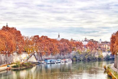 Scenic view of river against cloudy sky