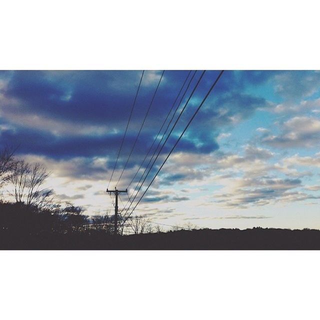 power line, electricity pylon, sky, silhouette, power supply, electricity, transfer print, low angle view, sunset, cloud - sky, fuel and power generation, connection, auto post production filter, cloud, cable, tranquility, nature, cloudy, technology, tranquil scene