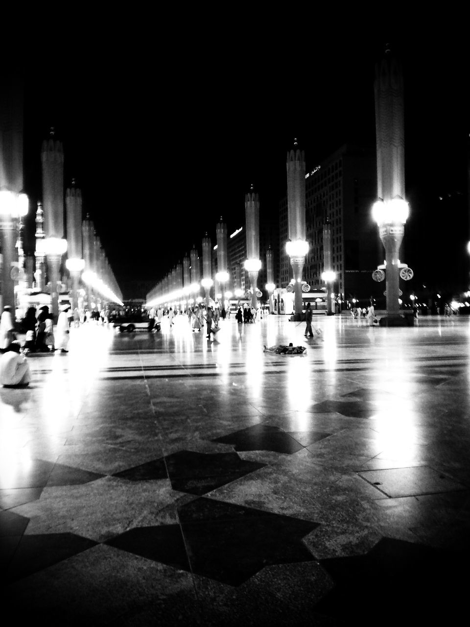 illuminated, night, lighting equipment, built structure, architecture, street light, in a row, building exterior, city, light - natural phenomenon, electric light, empty, glowing, lit, reflection, copy space, incidental people, dark, clear sky, flooring