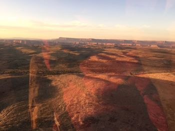 Scenic view of landscape against cloudy sky