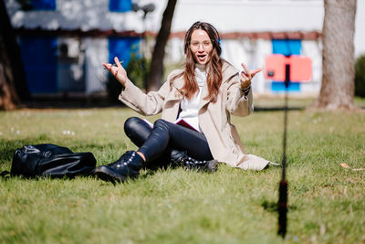 Woman sitting on field