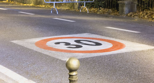 High angle view of arrow sign on road