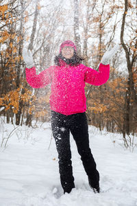 View of person standing on snow covered land