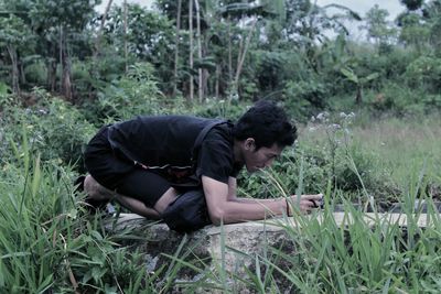 Man photographing plants