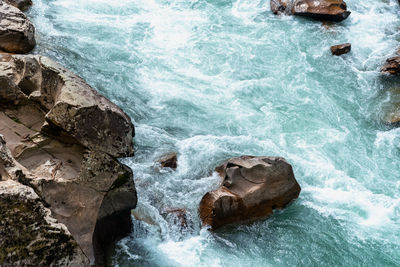 High angle view of rocks in sea