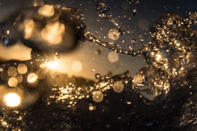 Close-up of splashing water during sunset