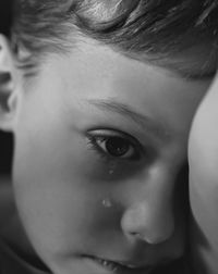 Close-up of boy crying at home