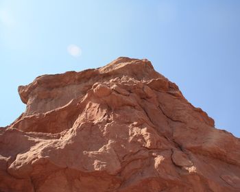 Scenic view of rocky mountains against clear blue sky