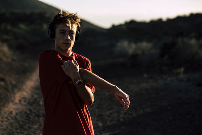 Portrait of man standing on field