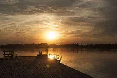 Scenic view of silhouette pier against sky during sunset