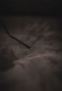 Close-up of metal grate on table