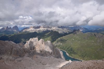 Scenic view of mountains against cloudy sky
