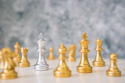 Close-up of chess pieces on table