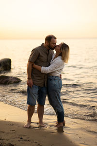 Middle aged couple kissing in the seaside. summer vacation