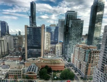 City skyline against cloudy sky