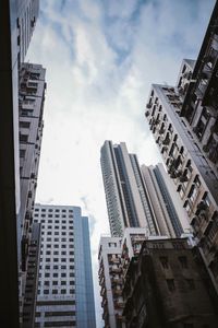 Modern buildings in city against sky