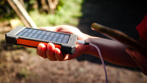 Close-up of man using mobile phone