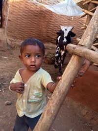 High angle portrait of boy standing outdoors