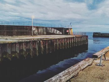 Pier over sea against sky