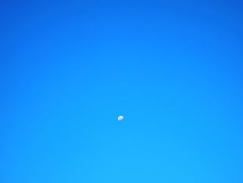 Scenic view of moon against clear blue sky