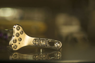 Close-up of metallic equipment on glass table