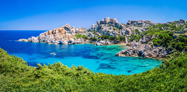 Scenic view of sea against clear blue sky